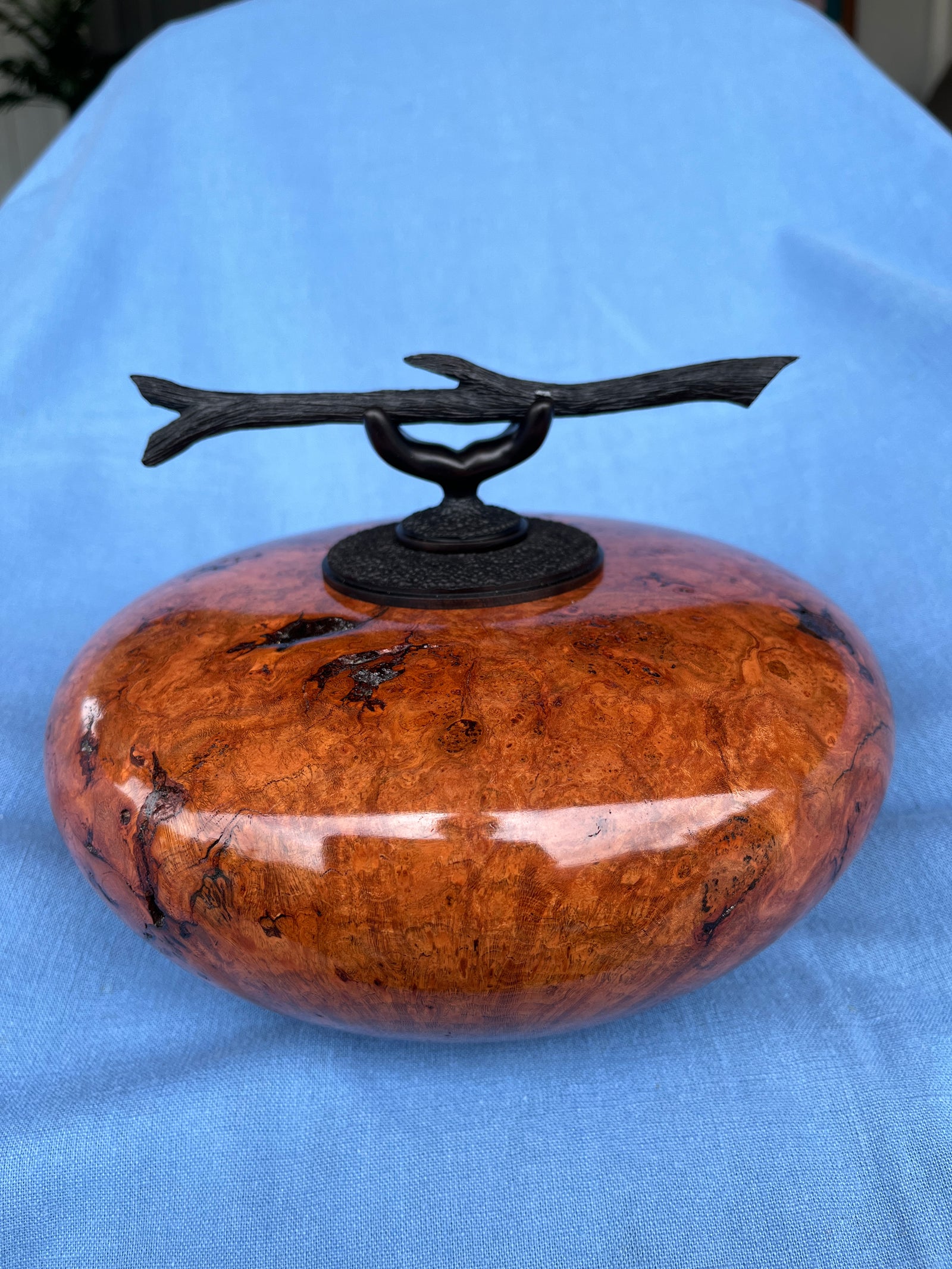 Craig Mason: Tropical Cherry burl hollow form with a burned and textured Milo wood collar and stopper